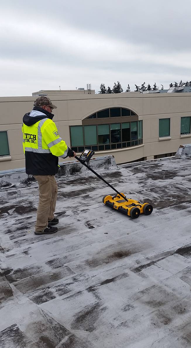 Scanning a commercial roof to determine if insulation has moisture.